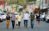 a group of people walking down a street