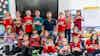 a group of children holding small flags