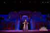 a woman in a dress on stage